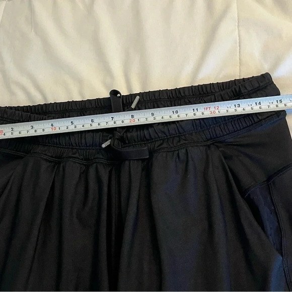 Lululemon black joggers with drawstring elastic waist band, and hemline.  Size 4 - Picture 11 of 13